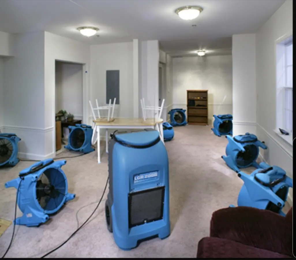 Air movers and dehumidifier setup for Water Damage Restoration in Clover